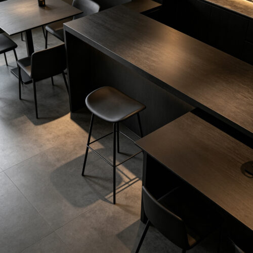 White Curved High Bar Stool in Black, styled campaign view
