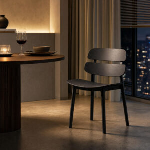 Contoured Plastic Dining Side Chair in Black, styled campaign view