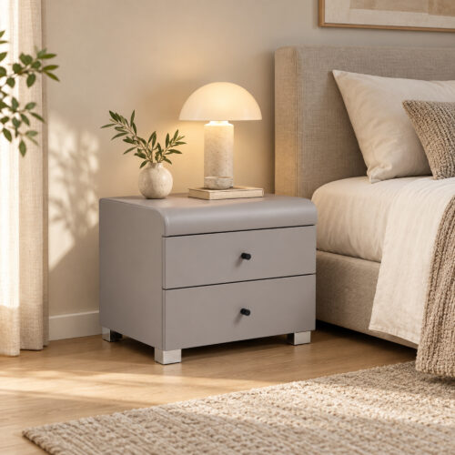 Cove Grey Two-Drawer Bedside Table — angled bedside view with a lamp