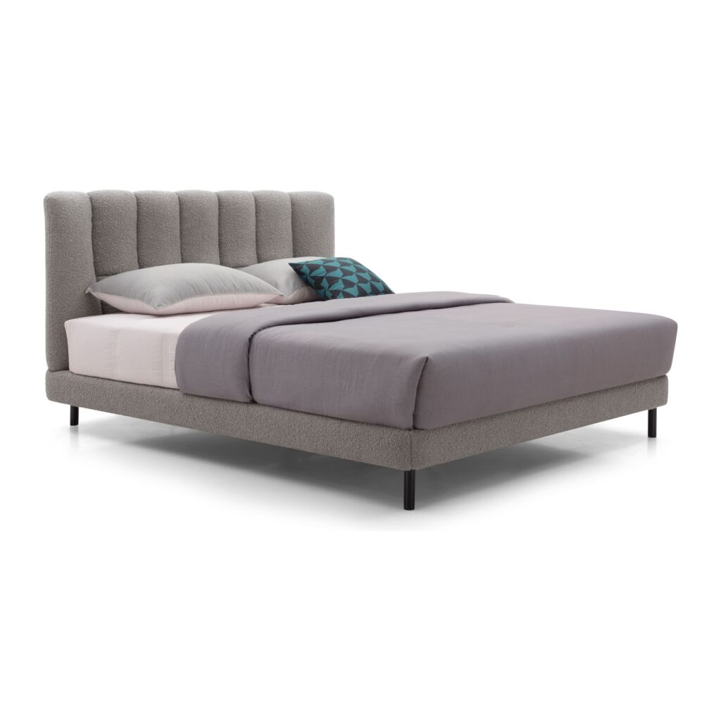 Miro Grey Channel Upholstered Bed Frame - King — three-quarter studio view; model photographs shared across sizes; mattress and bedding not included