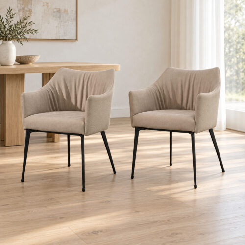 Harrow Dining Chair Set — two matching taupe chairs, front view in a bright oak dining room. Other furnishings are staging only.