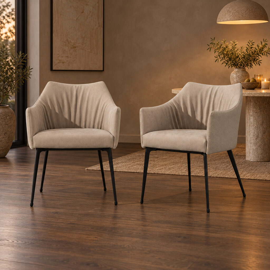 Harrow Dining Chair Set — two matching taupe chairs, front view in a warmly lit evening dining corner. Other furnishings are staging only.