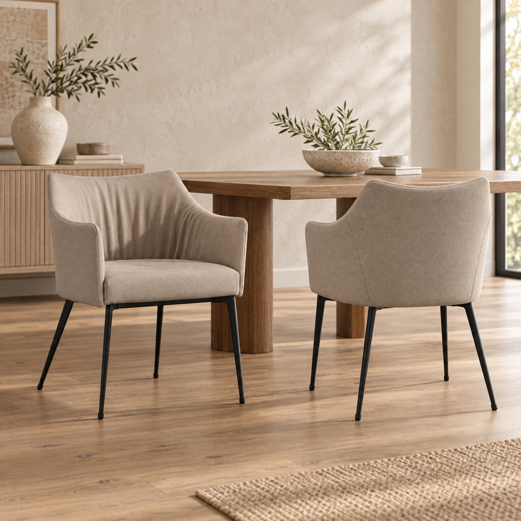 Harrow Dining Chair Set — two matching taupe chairs, front and rear views beside an oak dining table. Other furnishings are staging only.