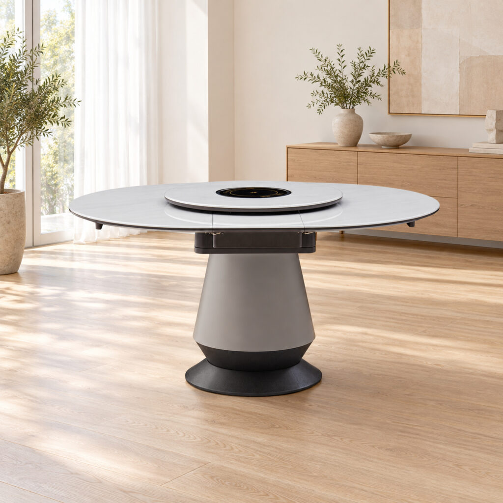 White Rotating-Leaf Extendable Dining Table in a bright ivory dining room; room furnishings are staging only and are not included.