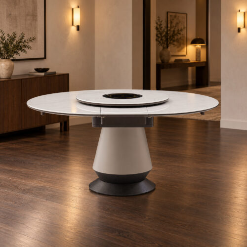 White Rotating-Leaf Extendable Dining Table in a warm contemporary evening interior; room furnishings are staging only and are not included.