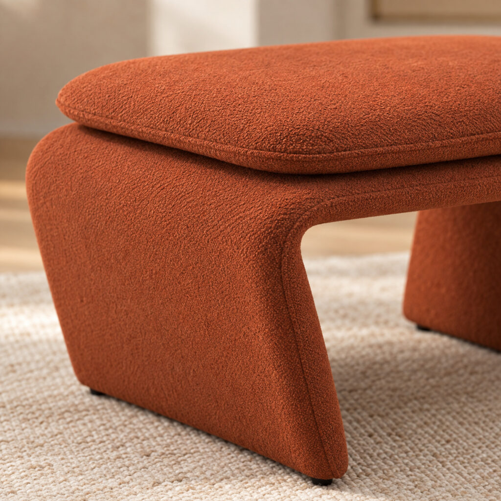 Rylan Camel Fabric Footstool with Curved Upholstered Supports — close detail of cushion and curved support